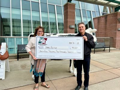 photo of James and Rosemary holding cheque