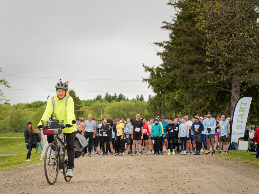 Photo of a large group of runners lined up at the start line for the Dairy Capital Run