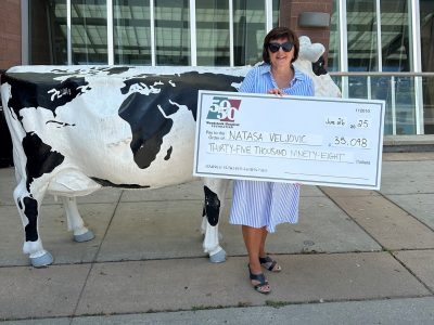 photo of Natasa holding cheque