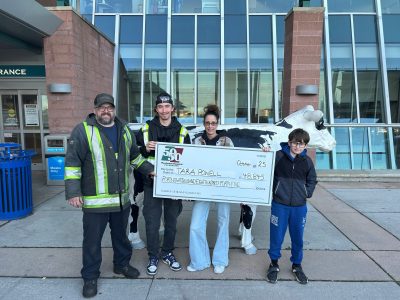 Winner Photo 2 Tara Powell and her family holding the cheque